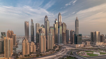 Naklejka na ściany i meble Skyscrapers of Dubai Marina near Sheikh Zayed Road with highest residential buildings morning timelapse