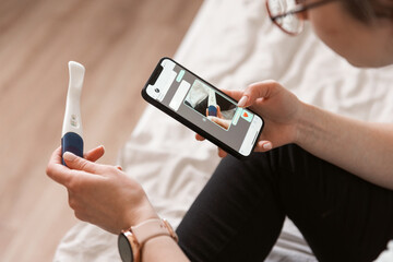 a woman takes a photo and sends a positive pregnancy test. The long-awaited pregnancy