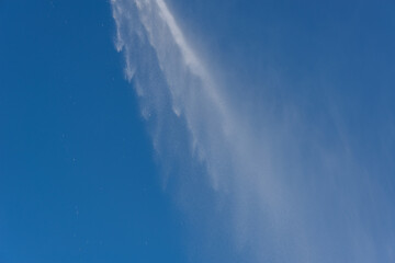 Naklejka na ściany i meble Drops of water in the sky, jet and small drops.