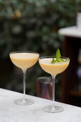Cocktail glass with Baileys Irish cream, passion fruit,