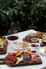 Italian antipasti wine snacks on table, outdoor party