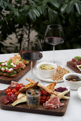 Italian antipasti wine snacks on table, outdoor party