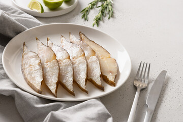 Delicious smoked halibut on white background. Close up. Copy space.