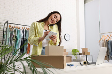 Seller talking on phone while working in office