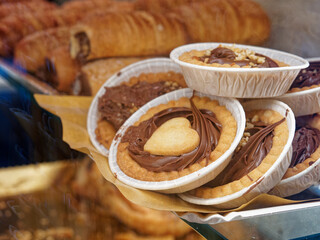 Chocolate tarts on a wooden board