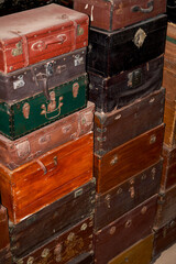 Pile of old vintage big wooden boxes stacked in a furniture store