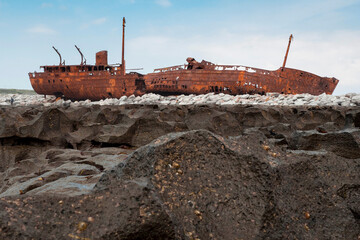 Plassey shipwreck on shore of Inisheer island. Aran islands, county Galway, Ireland. Rough stone...