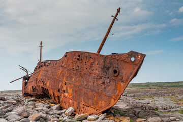 Plassey shipwreck on shore of Inisheer island. Aran islands, county Galway, Ireland. Rough stone...