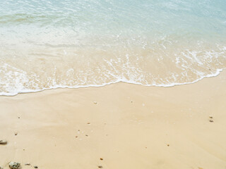 Fototapeta na wymiar Waves touching sandy beach. Tropical sea, empty beach. Phuket, Thailand.