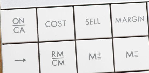 COST, SELL words on the keys of the calculator.