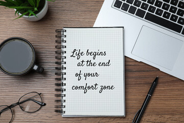 Life Begins At The End Of Your Comfort Zone. Motivational quote inspiring to do something new, different from ordinary life. Text in notebook, laptop, cup of coffee,