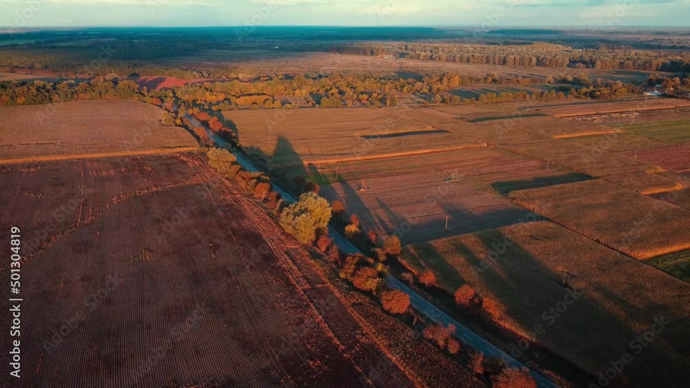 Canvas Prints Bright video of village in golden evening sunlight. Aerial view