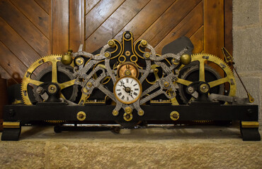 old clock of a black and gold bell tower
