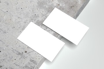 3d render of business card mockup on gray and granite background