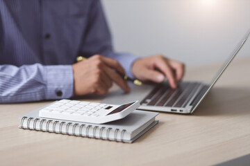 Close up business man working on laptop. Modern Finance and Accounting Concepts Using Accounting Software