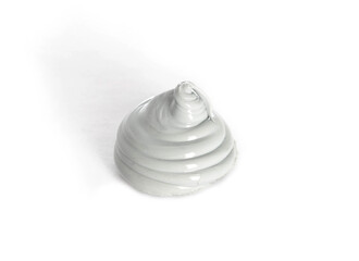 High quality automotive high temperature sealant. Gray universal one-component sealant, macro. White background, isolate.