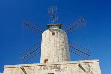 Obraz premium Traditional windmill in Malta against blue skies