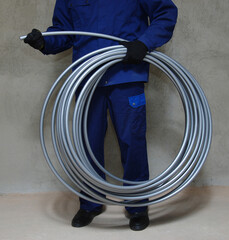 Plumber installing plastic pipes