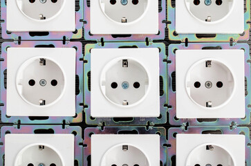 Background from home electric sockets, close-up. The concept of tariffs and prices for electricity