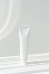 White cream tube cosmetics container mockup on white background. Beauty and medicine mockup with shadows. Minimalist modern mockup © Анна В