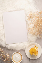 blank calendar mockup with carrot cake dessert, coffee and flowers on white rug