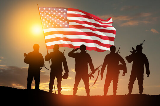 Silhouettes of soldiers with USA flag against the backdrop of a sunset. Greeting card for Veterans Day, Memorial Day, Independence Day. USA celebration. Patriotism, protection, remember honor.