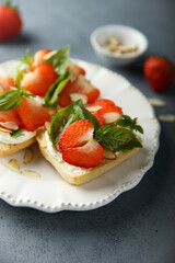 Strawberry crostini with basil and almond 