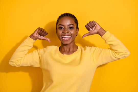 Portrait of attractive cheerful glad girl demonstrating herself select index indicate isolated over bright yellow color background