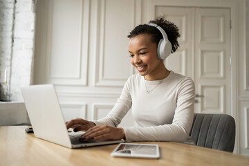 Wearing headphones student young woman online video communication training