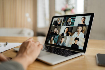 Online video communication report female designer uses internet in office laptop computer