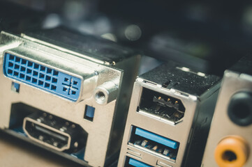 Fototapeta premium HDMI, DVI, USB ports on the back of the computer motherboard to connect peripheral devices. The monitor connection connector. Selective focus