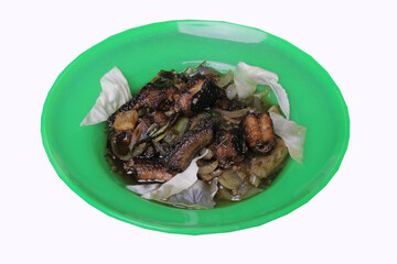 closeup, dish of green chili eel on green plate. clipping path