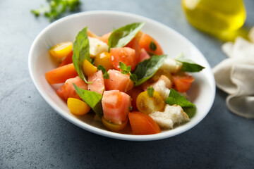 Homemade Panzanella salad with fresh basil