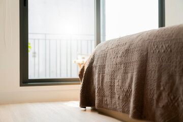 close up soft bed blanket and fur carpet rug near window bedroom home interior design concept background