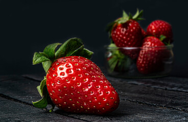 ripe strawberries on a black background close up