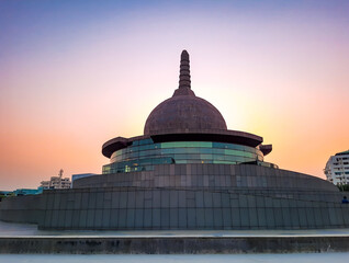 buddha stupa with bright colorful evening sky at dusk from different angle