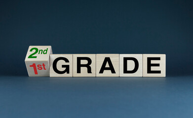Obraz premium Cubes form the words 1st grade to 2nd grade.