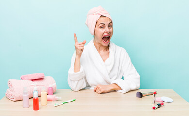 young pretty woman  feeling like a happy and excited genius after realizing an idea. making up...