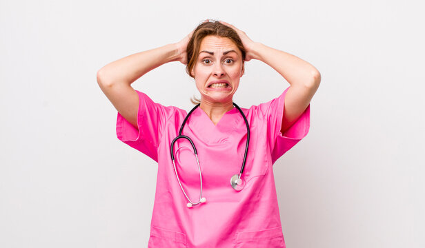 young pretty woman  feeling stressed, anxious or scared, with hands on head. veterinarian concept