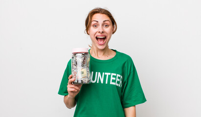 young pretty woman  looking happy and pleasantly surprised. volunteer concept
