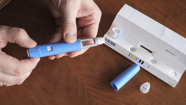 obese fat man preparing Semaglutide Ozempic injection control blood sugar levels