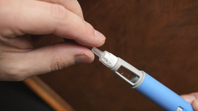 obese fat man preparing Semaglutide Ozempic injection control blood sugar levels