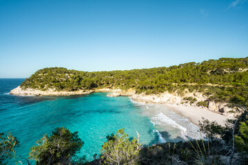 View of Mitjaneta beach with beautiful turquoise sea water, Menorca island, Spain
