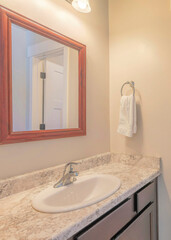 Vertical Bathroom interior with two doorways and a view of a room with window
