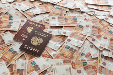 Russian rubles, cash are on the desk in the office. The passports are on top. Trip
