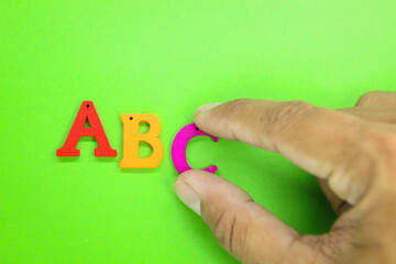 hands holding the colored letters ABC. The concept of pre -school education. Education concept