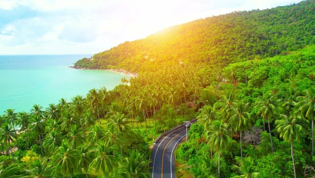 Drones are flying over beautiful beaches, roads and seas. The Gulf of Thailand. The turquoise waters are unique to the tropical seas. many coconut trees. Khanom-Sichon road. Nakhon Si Thammarat, Thail