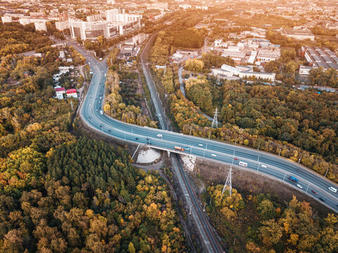 Aerial view of railway and car highway bridge in the city area. Transport and industry concept