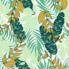 Abstract seamless tropical pattern with bright plants and leaves on a gray background. Seamless exotic pattern with tropical plants. Tropic leaves in bright colors. Exotic jungle wallpaper.