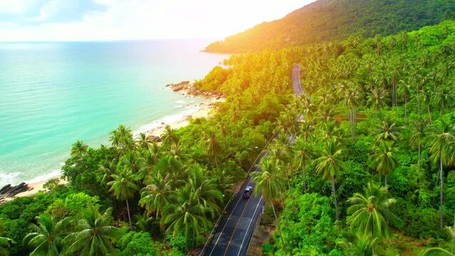 Drones are flying over beautiful beaches, roads and seas. The Gulf of Thailand. The turquoise waters are unique to the tropical seas. many coconut trees. Khanom-Sichon road. Nakhon Si Thammarat, Thail